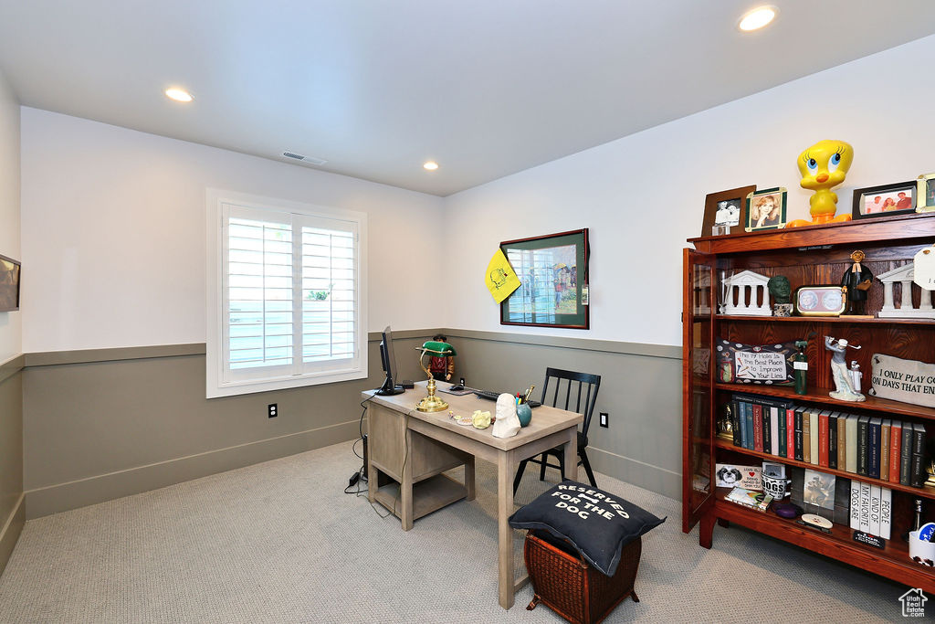 Carpeted office featuring recessed lighting