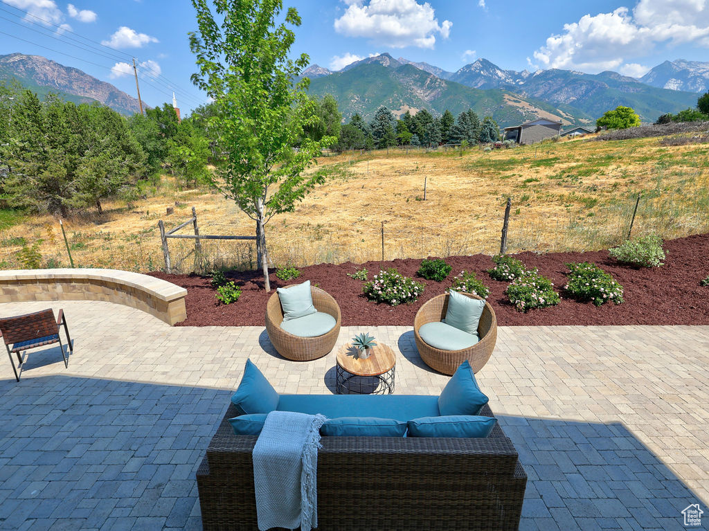 View of patio / terrace with a mountain view and an outdoor living space