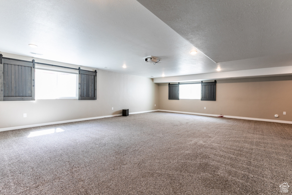 Unfurnished room with carpet floors and baseboards