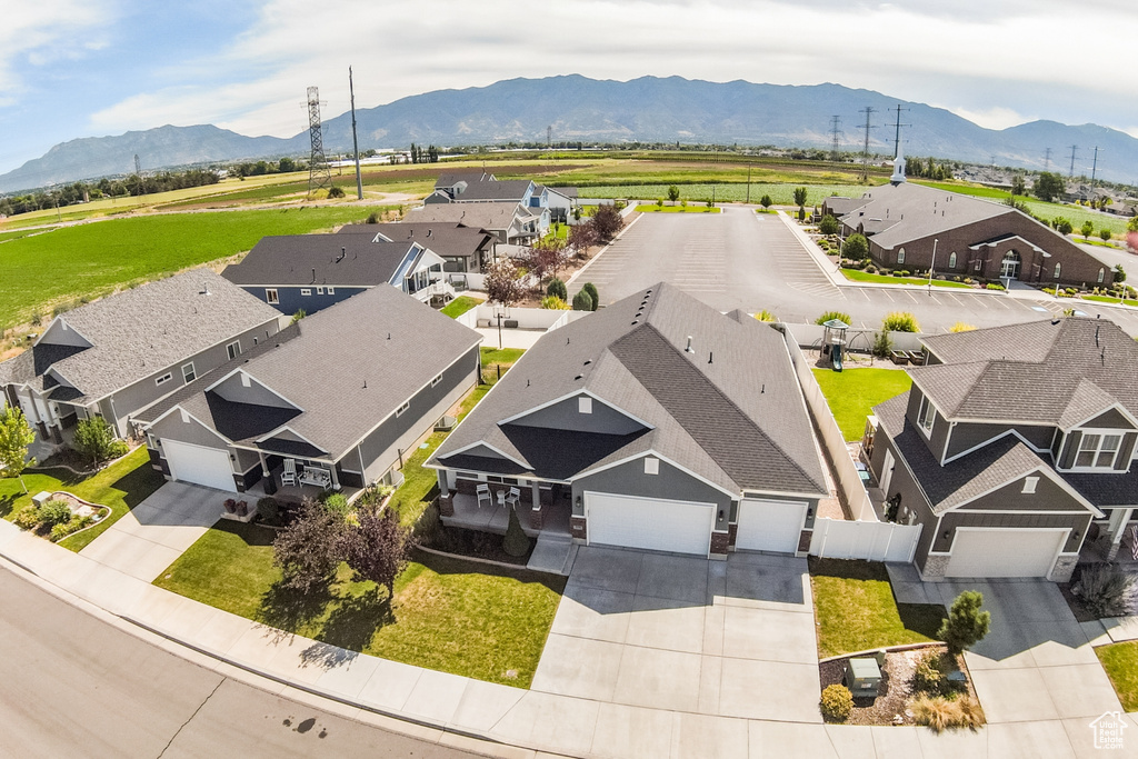 Aerial view of residential area featuring a mountain backdrop