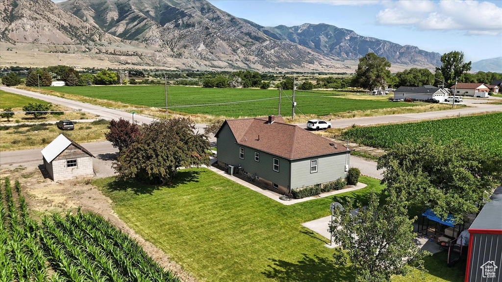 View of mountain backdrop with rural landscape