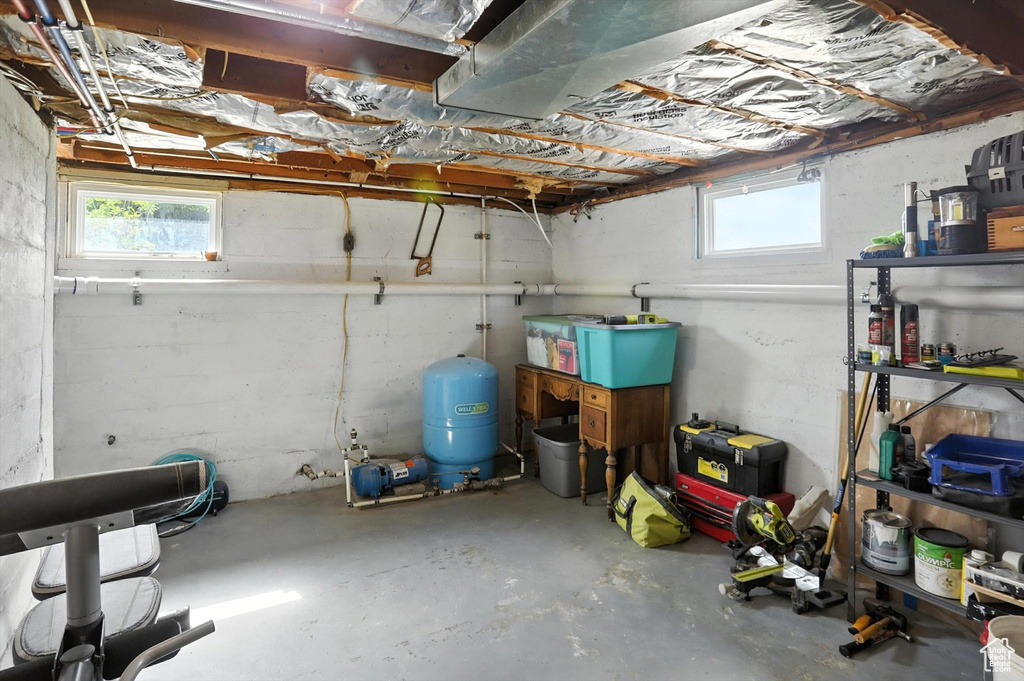 Below grade area with a water pressure tank