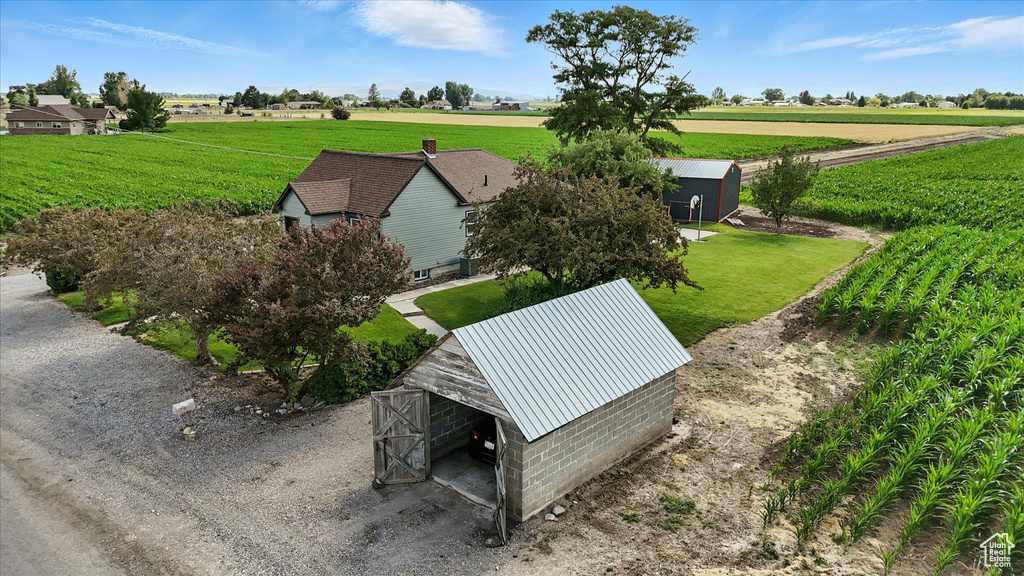 Aerial view of sparsely populated area with rows of crops