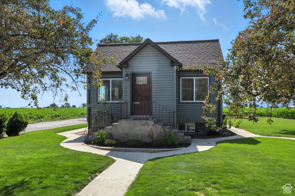 Bungalow-style home featuring a front yard