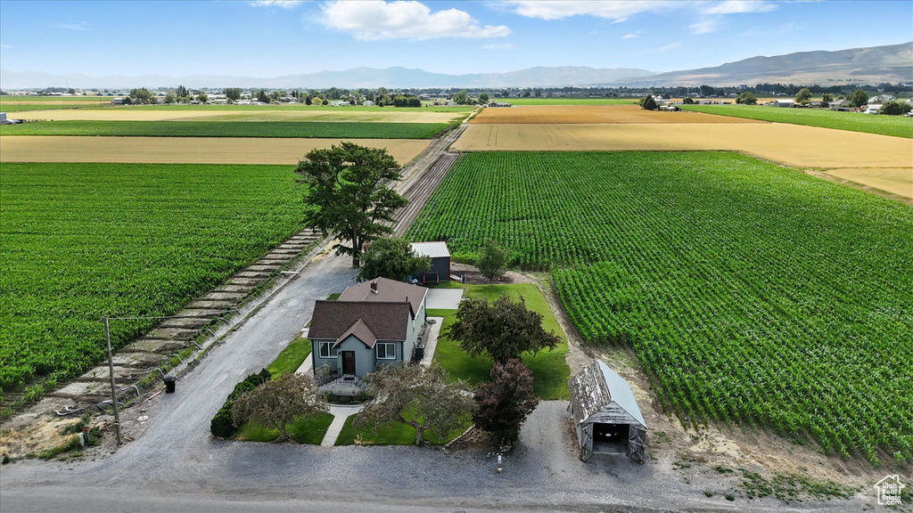 Aerial view of sparsely populated area featuring abundant farmland and mountains