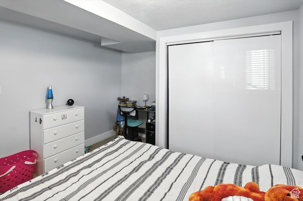 Bedroom featuring a closet and baseboards