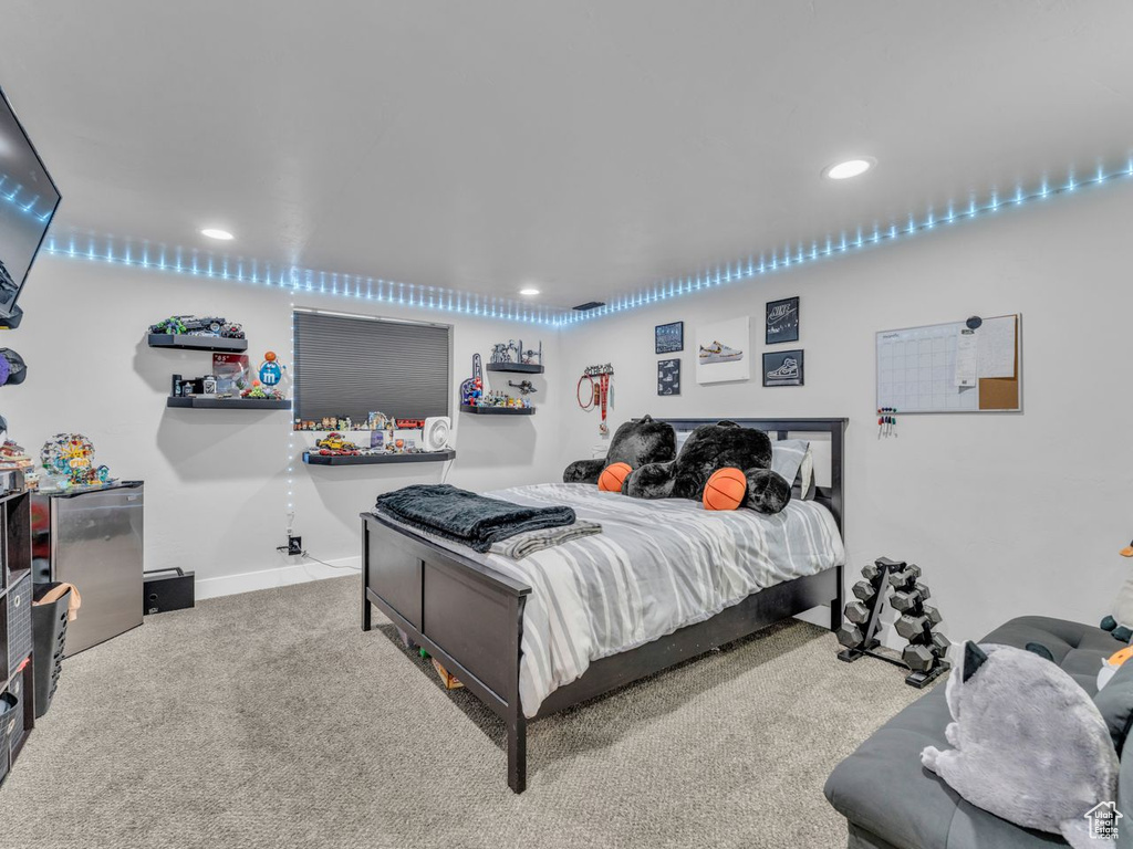 Carpeted bedroom featuring recessed lighting and baseboards