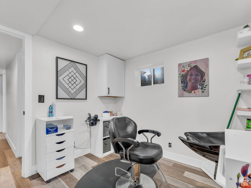 Office space featuring light wood-type flooring and recessed lighting