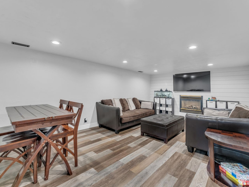 Living area featuring recessed lighting and light wood-type flooring