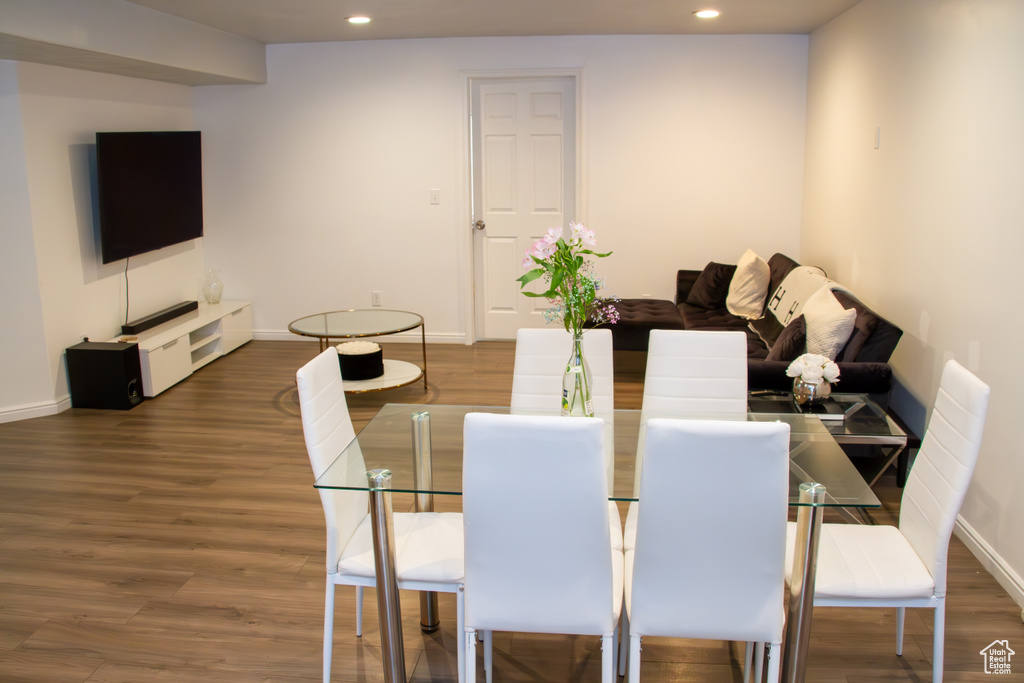 Dining area with recessed lighting and wood finished floors