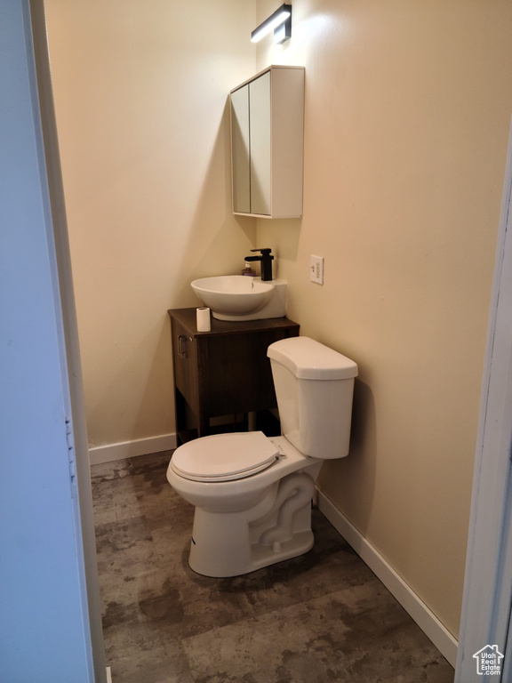 Bathroom with vanity and baseboards