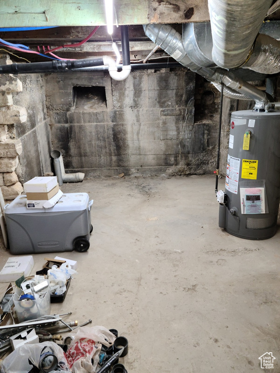 Unfinished basement with gas water heater
