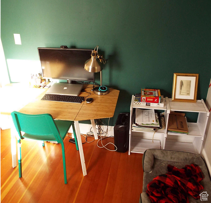 Office with wood finished floors