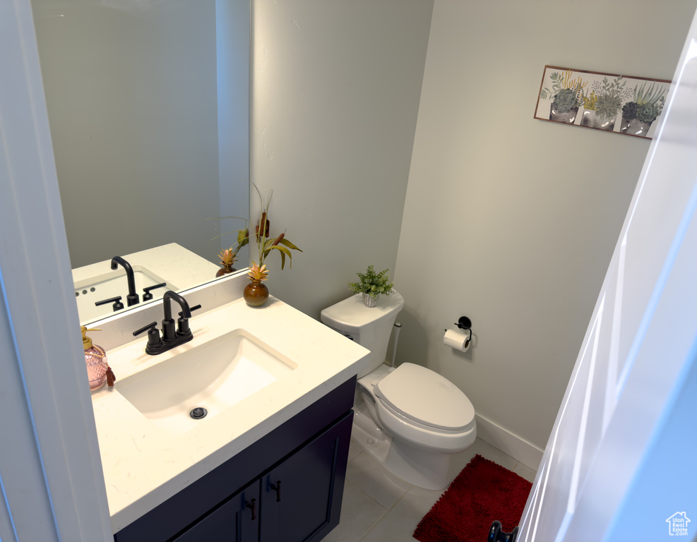 Bathroom featuring vanity and tile patterned floors