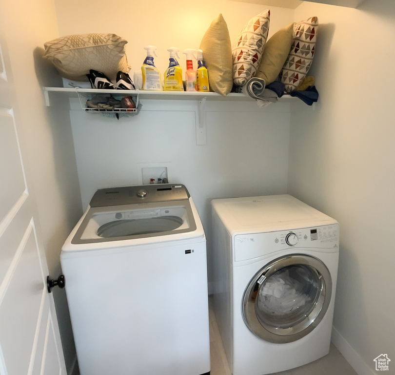 Laundry room with washing machine and dryer