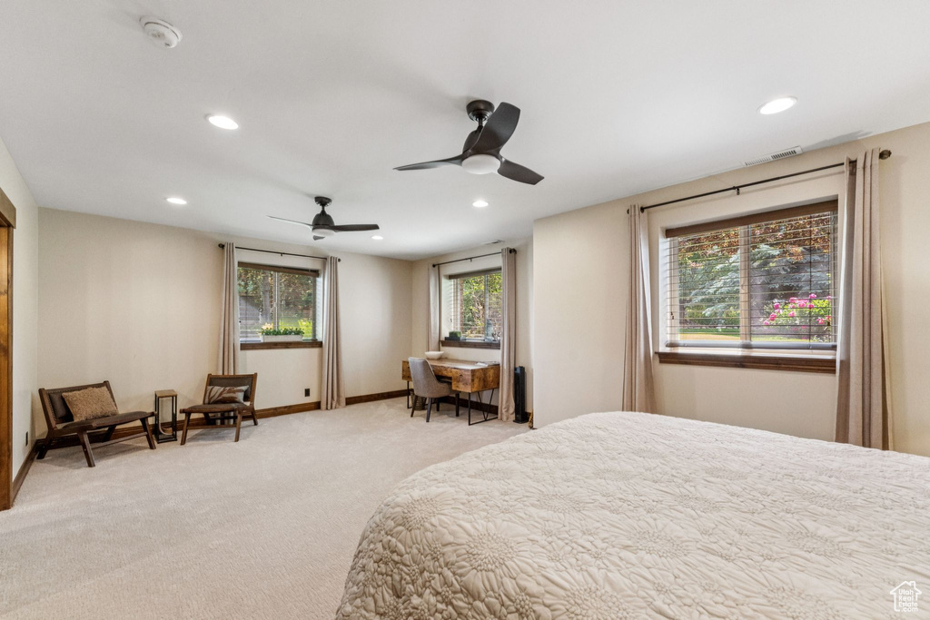Bedroom featuring light colored carpet, recessed lighting, and ceiling fan