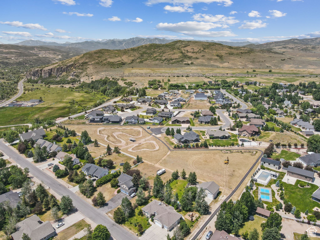 View of property location with mountains and nearby suburban area