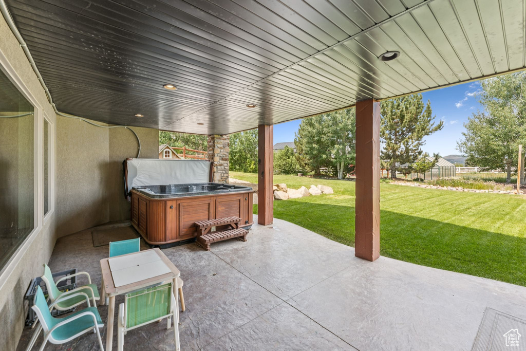 View of patio featuring a hot tub