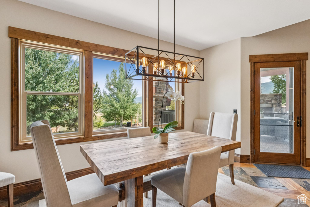Dining room with a chandelier and baseboards
