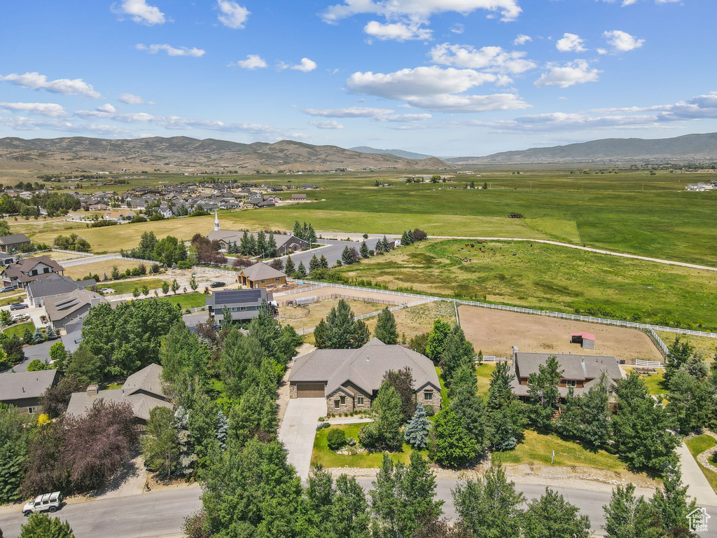Aerial view of residential area featuring a mountain backdrop