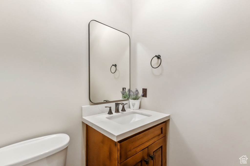 Bathroom with toilet and vanity