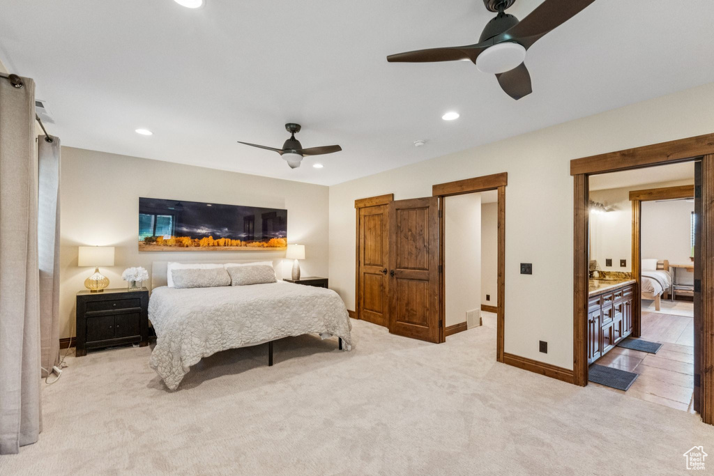 Bedroom with light carpet, recessed lighting, and a ceiling fan