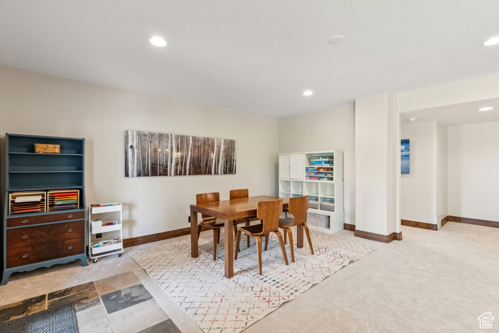 Dining area with recessed lighting and carpet flooring