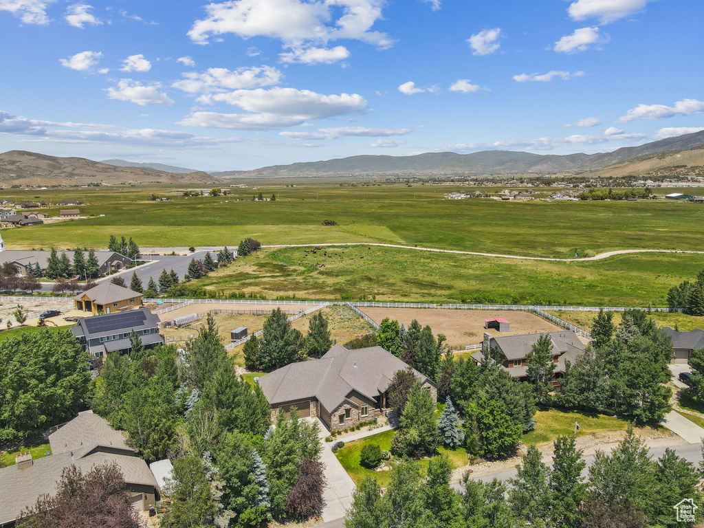 Aerial perspective of suburban area with a mountainous background