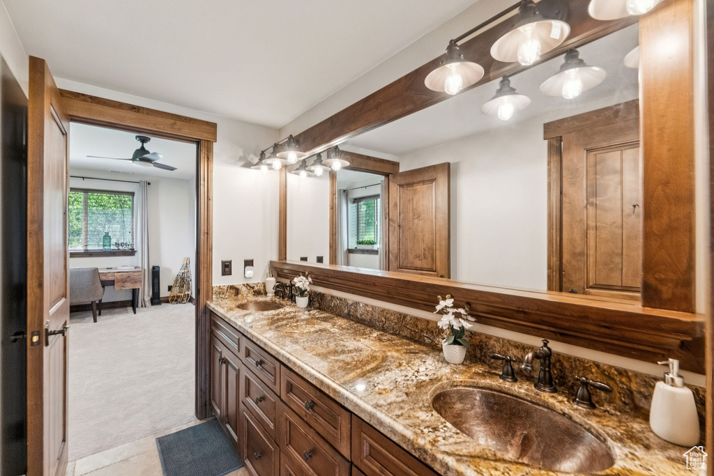 Bathroom with double vanity and ceiling fan