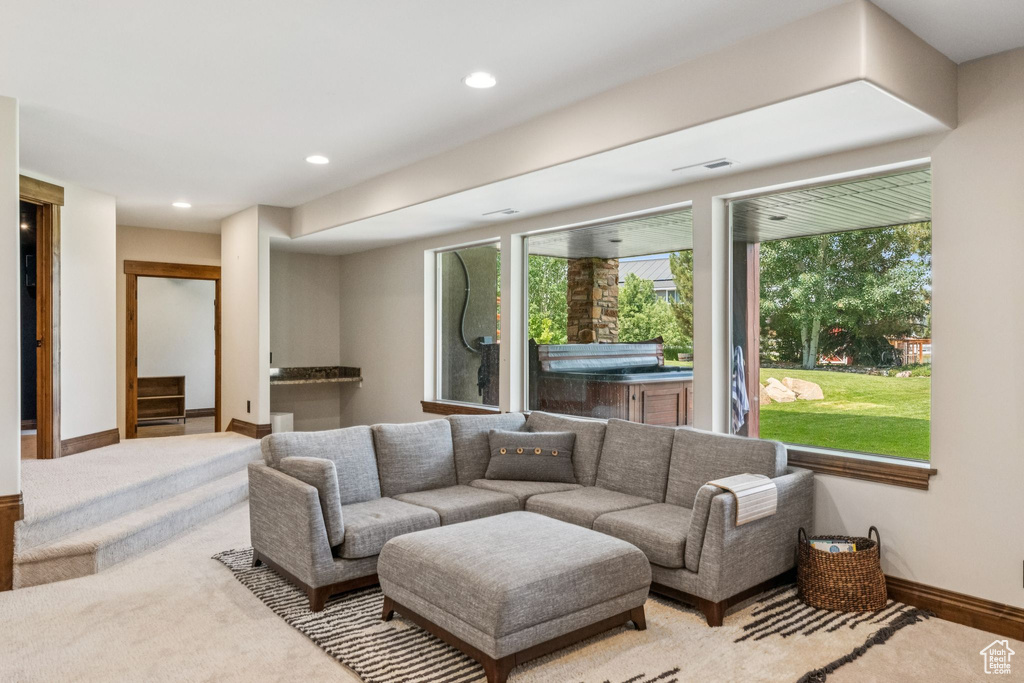 Living room with recessed lighting and baseboards