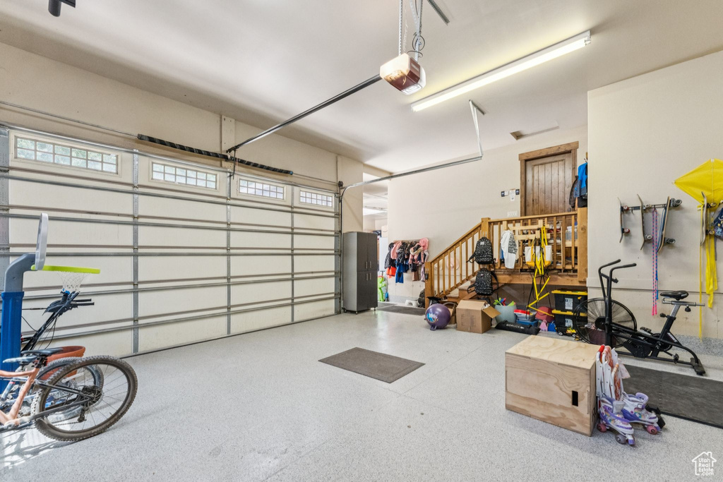 Garage featuring a garage door opener