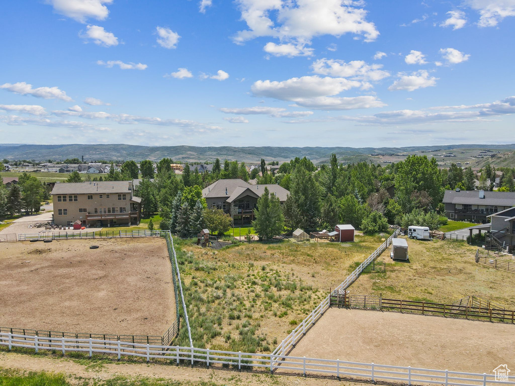Aerial view of sparsely populated area with a mountain backdrop