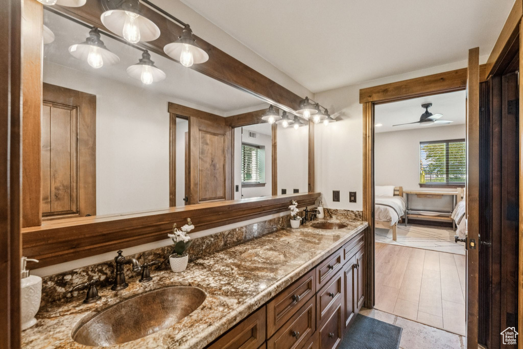 Ensuite bathroom featuring double vanity