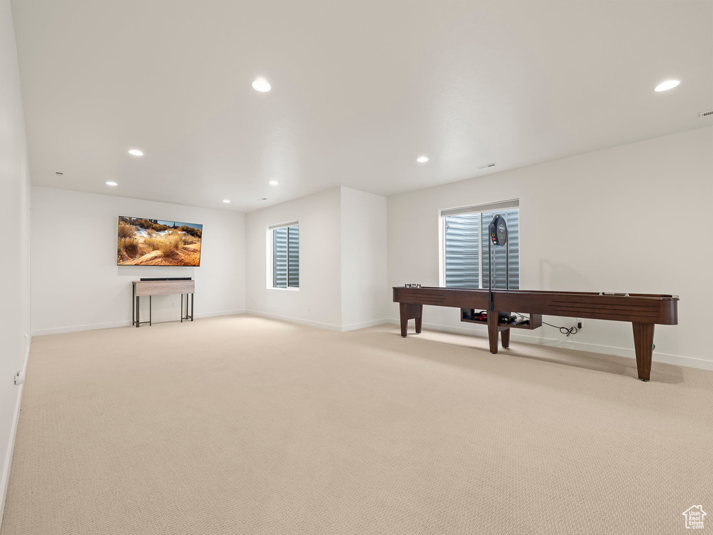 Living room featuring recessed lighting and light colored carpet
