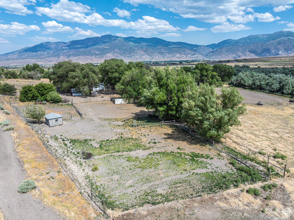 View of mountain backdrop featuring rural landscape