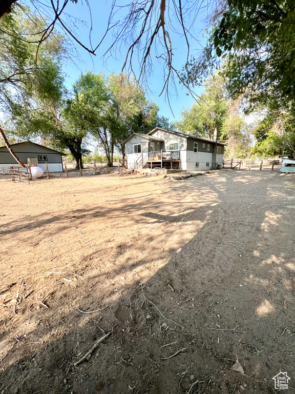 View of yard featuring a wooden deck