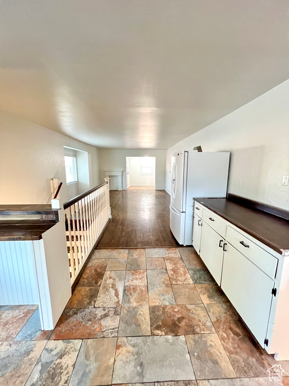 Hallway featuring stone tile flooring