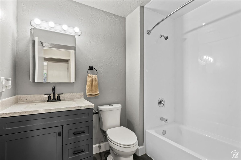 Full bath with vanity and bathtub / shower combination