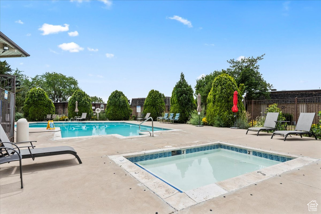 Community pool with a patio area
