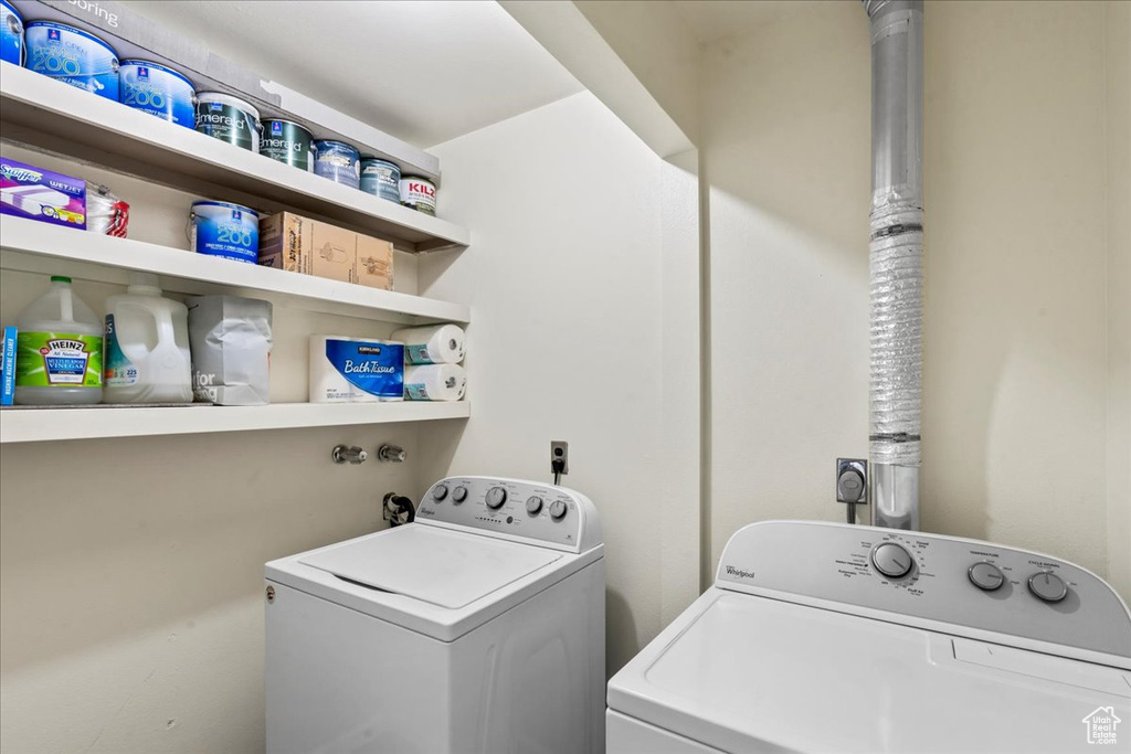 Laundry room featuring washer and clothes dryer