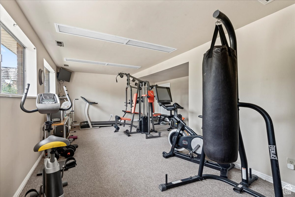 Exercise area featuring baseboards