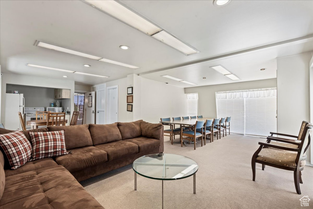 Living area with carpet flooring and recessed lighting