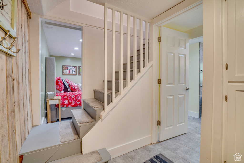 Stairway featuring tile patterned flooring