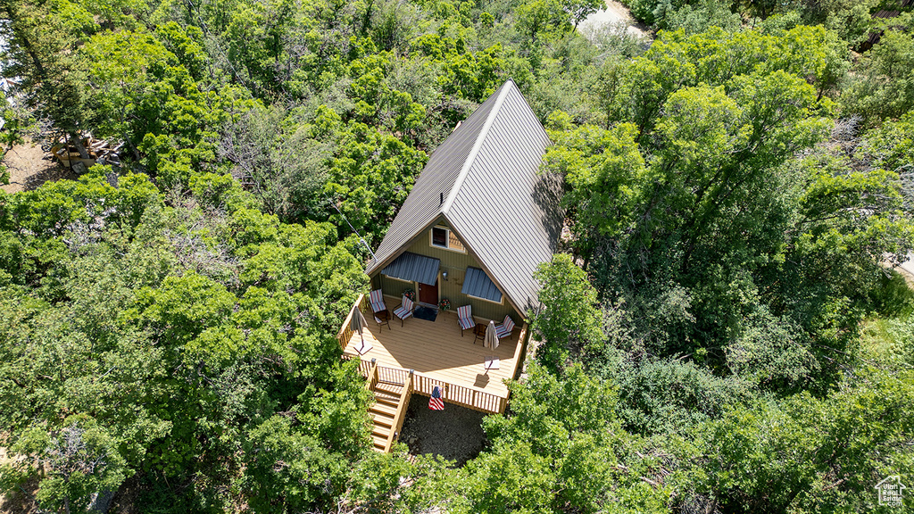 View of subject property featuring a heavily wooded area