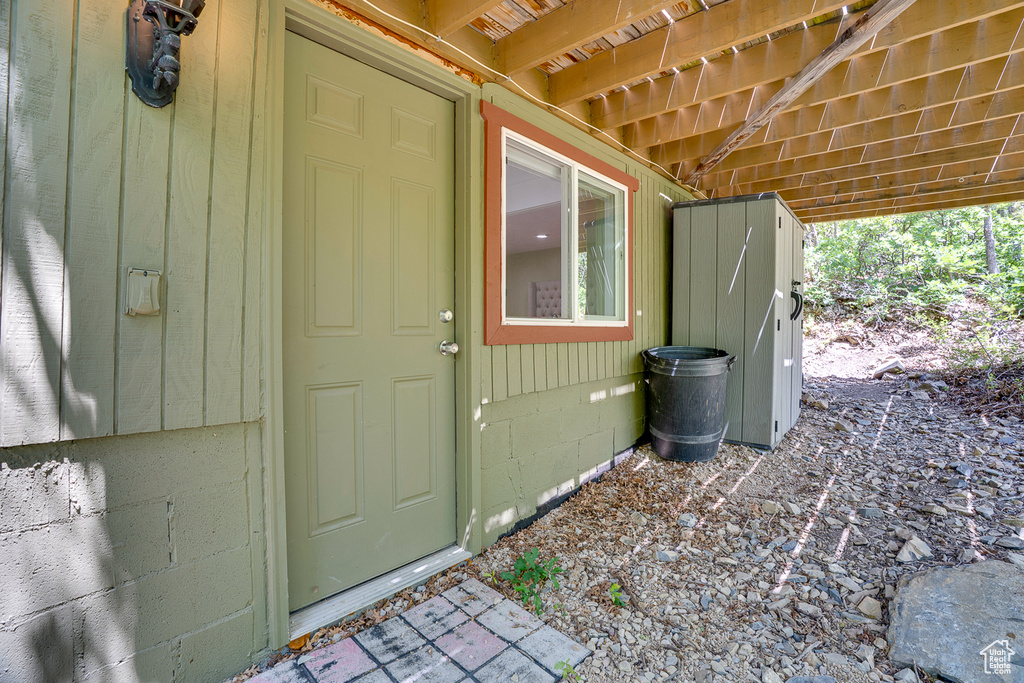 View of exterior entry featuring crawl space