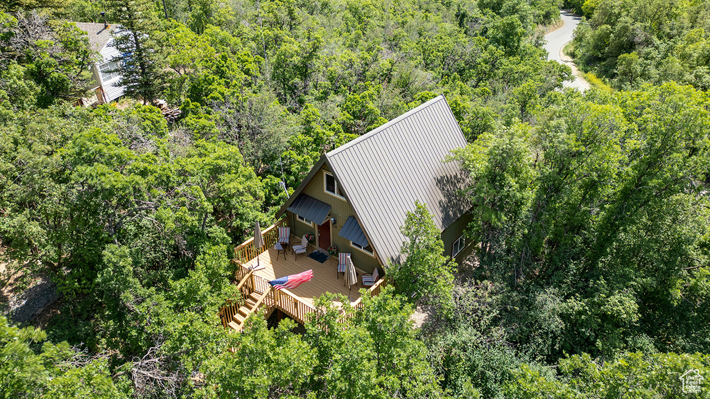View of subject property featuring a heavily wooded area