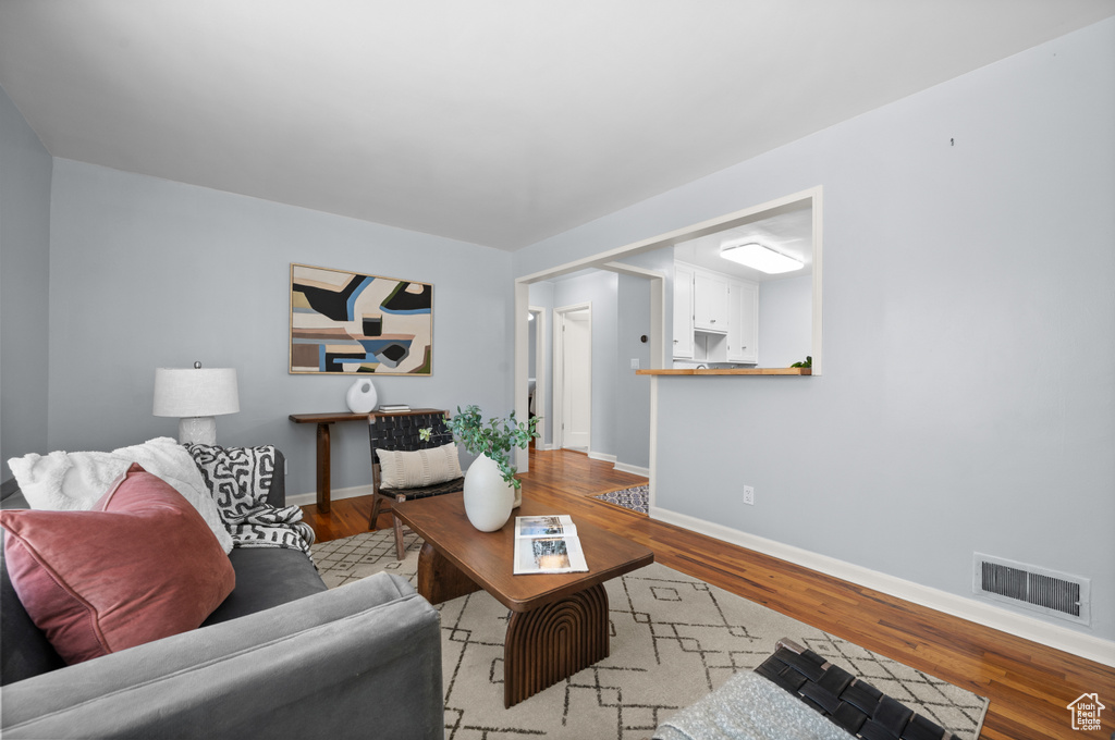 Living room with wood finished floors and baseboards