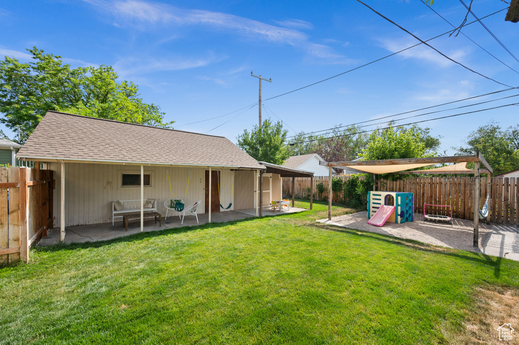 Fenced backyard featuring a patio area