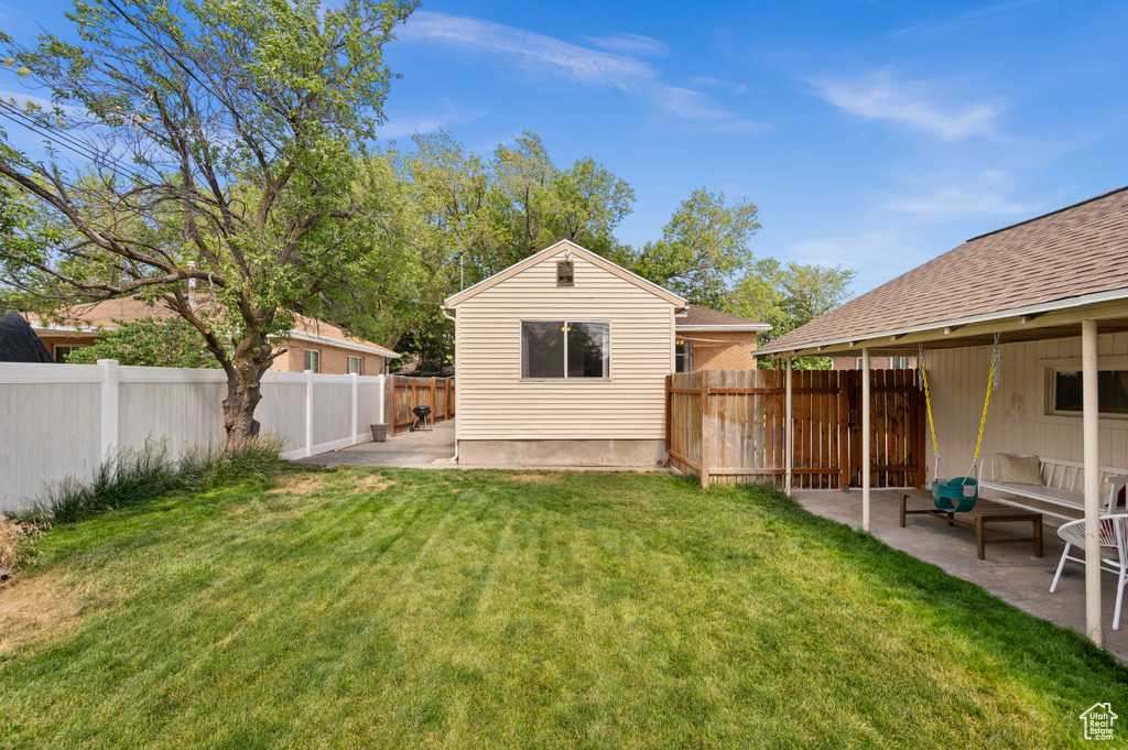 Fenced backyard featuring a patio area