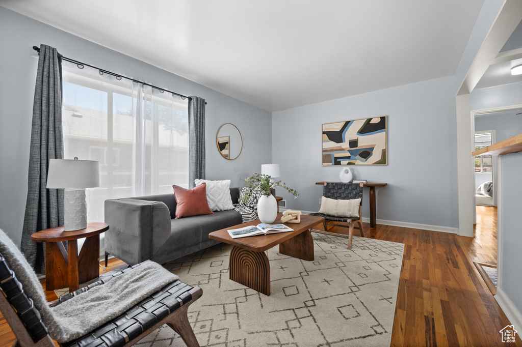 Living room featuring wood finished floors and baseboards